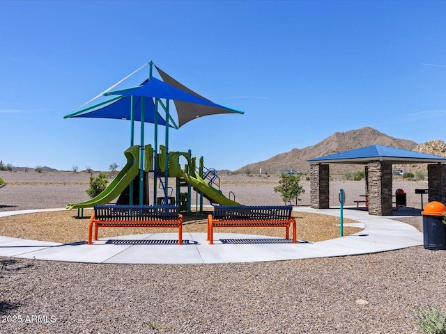 view of playground with a mountain view