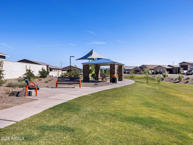 view of property's community featuring a gazebo and a lawn