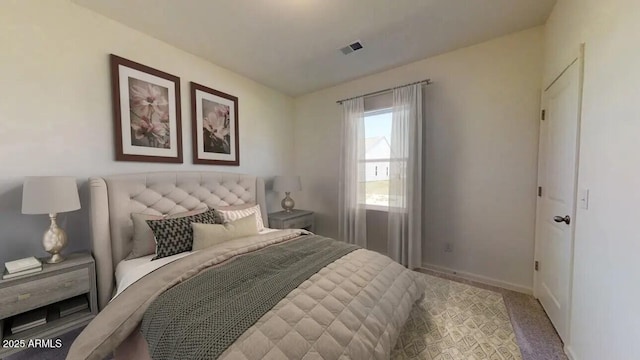 bedroom featuring visible vents, baseboards, and carpet floors