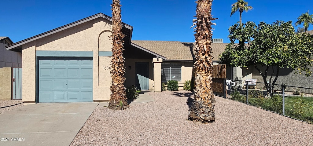 single story home featuring a garage