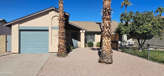 single story home featuring a garage