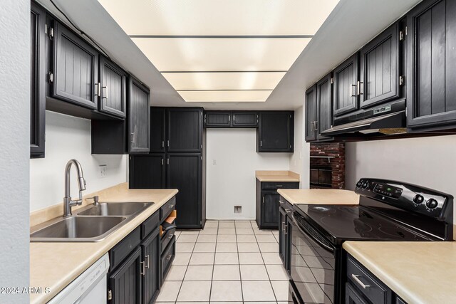 kitchen with black range with electric cooktop, white dishwasher, sink, light tile patterned floors, and range hood