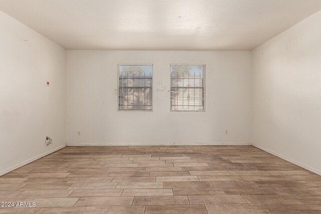 empty room with light hardwood / wood-style floors