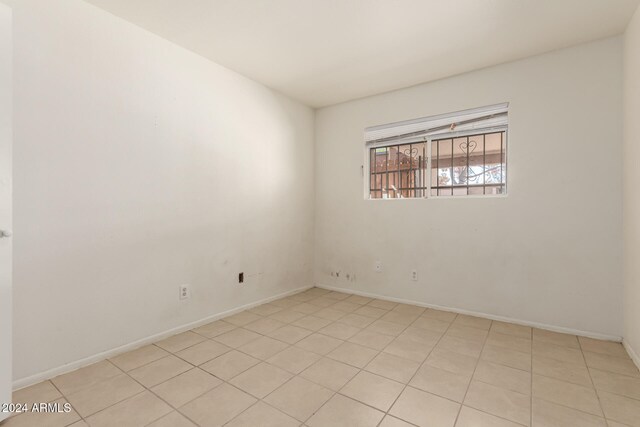 view of tiled spare room