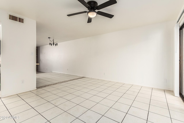 unfurnished living room featuring ceiling fan and light tile patterned flooring