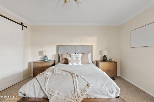 bedroom featuring carpet flooring, ornamental molding, and a barn door