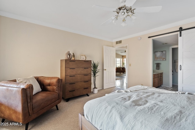 bedroom featuring connected bathroom, ceiling fan, a barn door, crown molding, and light colored carpet