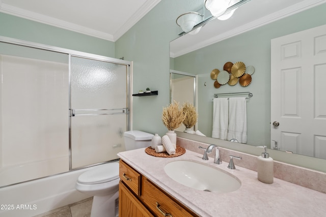 full bathroom featuring combined bath / shower with glass door, toilet, tile patterned floors, vanity, and crown molding