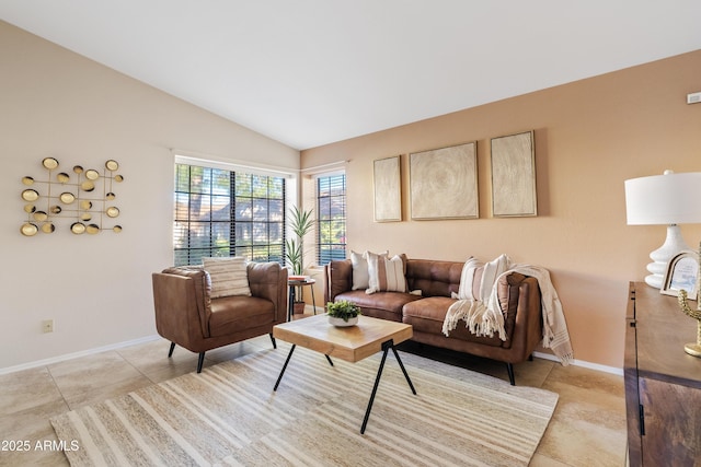 living room with lofted ceiling and light tile patterned floors