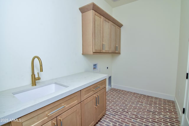 laundry area featuring hookup for an electric dryer, hookup for a washing machine, baseboards, a sink, and cabinet space