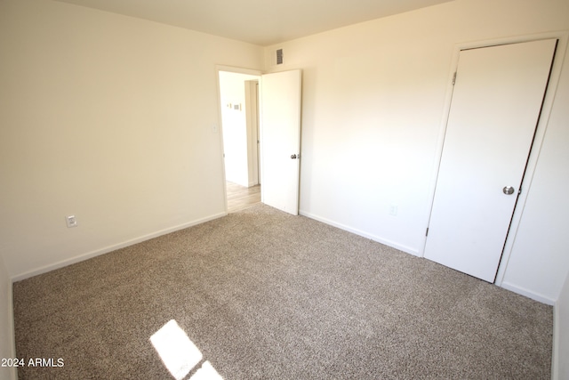 unfurnished bedroom with carpet flooring