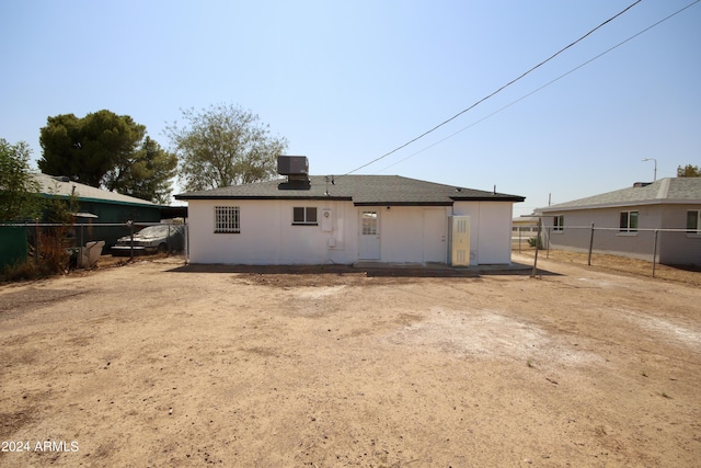 back of property featuring central air condition unit