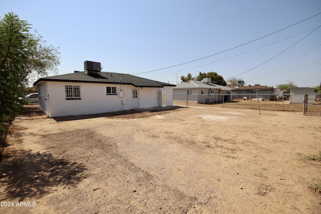 back of property with central air condition unit