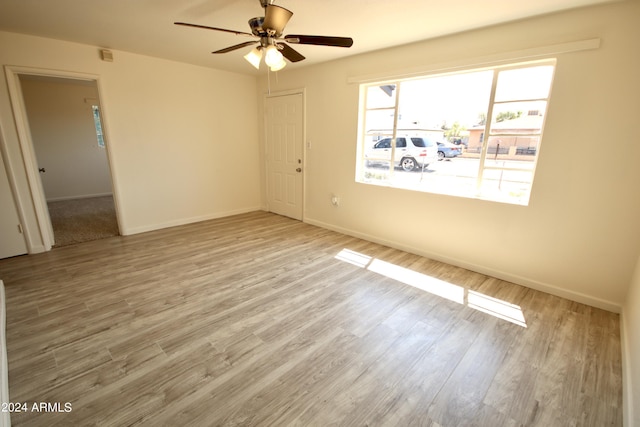 unfurnished room with ceiling fan and light hardwood / wood-style floors