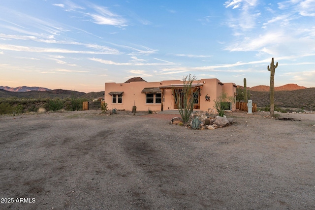 3874 Pura Vida Trl, Wickenburg, AZ 85390 - pueblo revival-style home featuring stucco siding and a mountain view