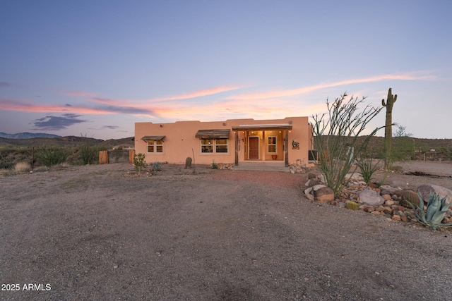 3874 Pura Vida Trl, Wickenburg, AZ 85390 - pueblo-style home featuring stucco siding