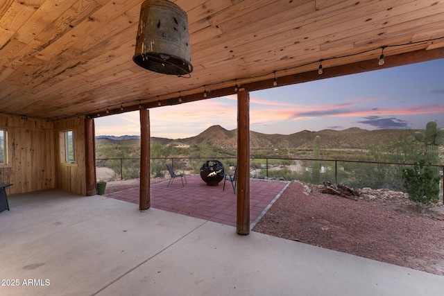 3874 Pura Vida Trl, Wickenburg, AZ 85390 - patio terrace at dusk with a mountain view