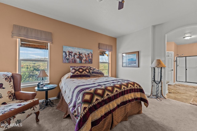 3874 Pura Vida Trl, Wickenburg, AZ 85390 - bedroom with carpet flooring, a ceiling fan, and baseboards