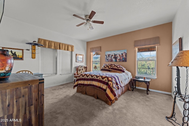 3874 Pura Vida Trl, Wickenburg, AZ 85390 - carpeted bedroom with baseboards and a ceiling fan