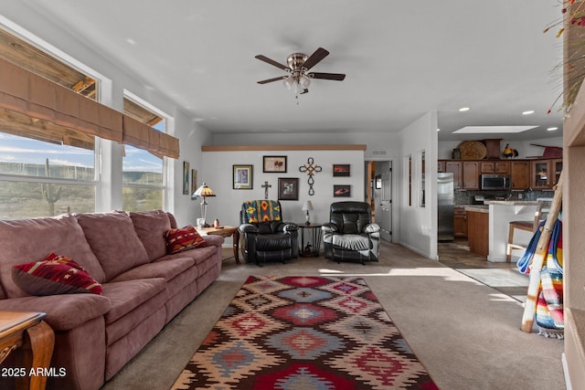 3874 Pura Vida Trl, Wickenburg, AZ 85390 - living room with light colored carpet, visible vents, recessed lighting, and a ceiling fan