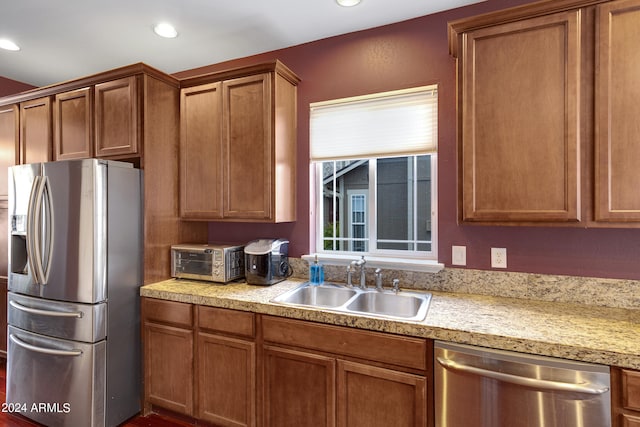 kitchen featuring stainless steel appliances and sink