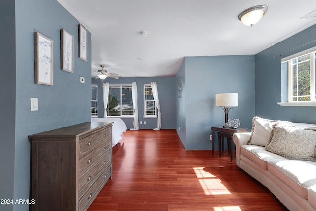 interior space with ceiling fan and dark wood-type flooring