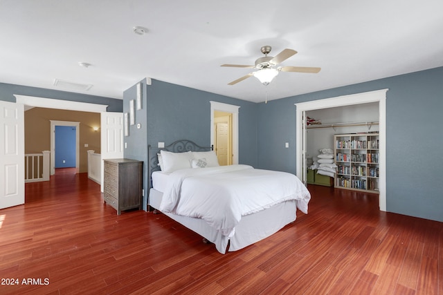 bedroom with ceiling fan, a closet, and dark hardwood / wood-style floors