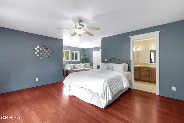 bedroom with ceiling fan, hardwood / wood-style flooring, and ensuite bathroom