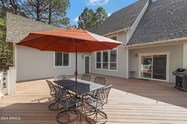 wooden deck featuring grilling area