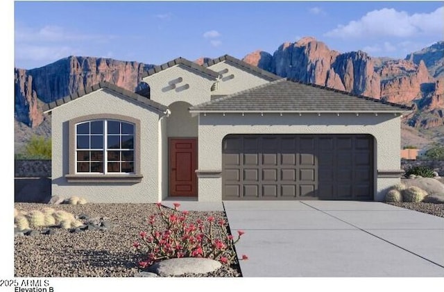 view of front of home featuring a mountain view and a garage