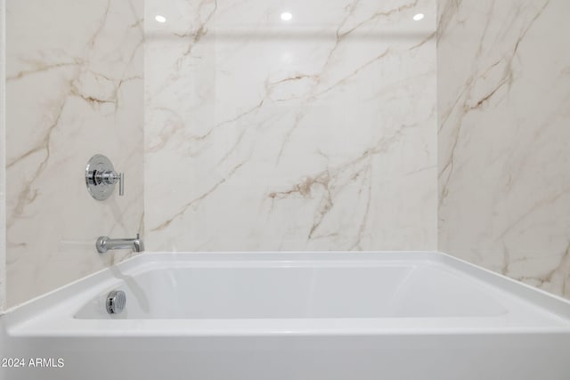 bathroom with a tub