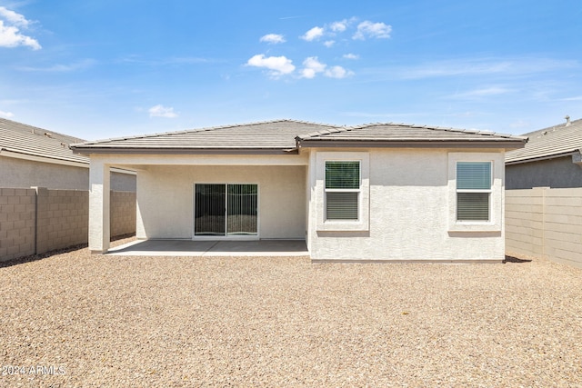 back of house with a patio area