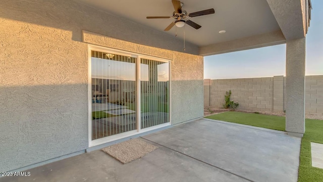 view of patio featuring ceiling fan