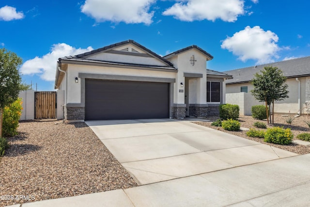 1281 W Highland Rd, San Tan Valley, AZ 85143 - view of front of house with stone siding, stucco siding, an attached garage, and driveway