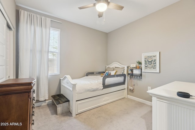 1281 W Highland Rd, San Tan Valley, AZ 85143 - bedroom with light carpet, baseboards, and ceiling fan