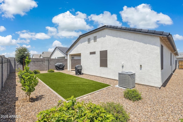 1281 W Highland Rd, San Tan Valley, AZ 85143 - rear view of house with stucco siding and central AC unit