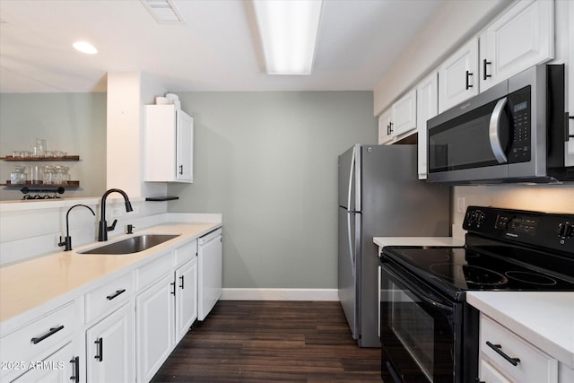 1505 N Center St Unit 218, Mesa, AZ 85201 - kitchen featuring black / electric stove, stainless steel microwave, baseboards, a sink, and light countertops