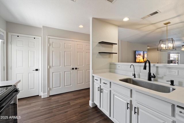 1505 N Center St Unit 218, Mesa, AZ 85201 - kitchen with a sink, light countertops, dark wood-style floors, white cabinets, and black / electric stove