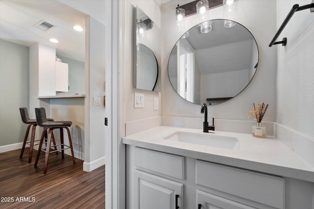 1505 N Center St Unit 218, Mesa, AZ 85201 - bathroom featuring vanity, wood finished floors, and baseboards