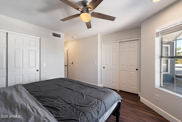 1505 N Center St Unit 218, Mesa, AZ 85201 - bedroom featuring dark wood-type flooring, baseboards, a closet, and a ceiling fan
