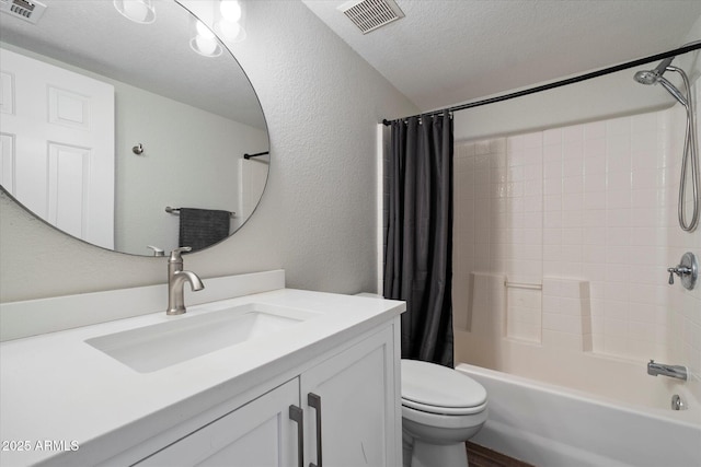 1505 N Center St Unit 218, Mesa, AZ 85201 - full bath with a textured ceiling, shower / bath combo, vanity, toilet, and a textured wall