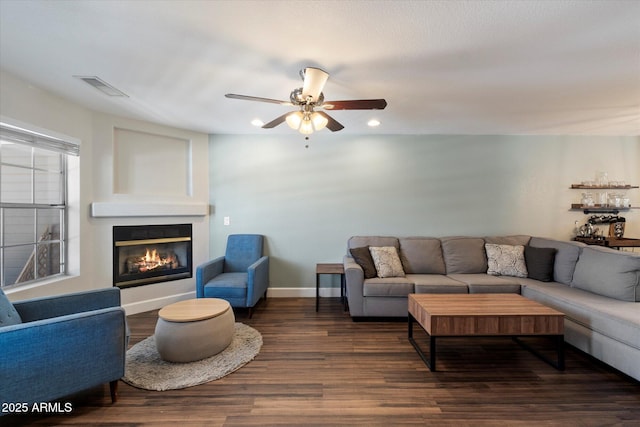1505 N Center St Unit 218, Mesa, AZ 85201 - living area with a glass covered fireplace, dark wood-style floors, a ceiling fan, recessed lighting, and baseboards