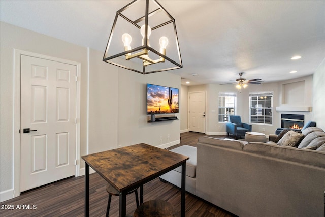 1505 N Center St Unit 218, Mesa, AZ 85201 - living room featuring dark wood-style floors, a glass covered fireplace, baseboards, a ceiling fan, and recessed lighting