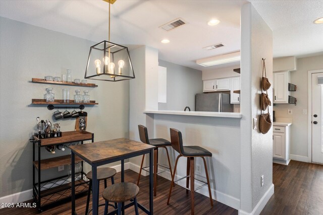1505 N Center St Unit 218, Mesa, AZ 85201 - dining room with baseboards, dark wood-style floors, recessed lighting, and a chandelier