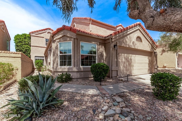 11288 E Sunnyside Dr, Scottsdale, AZ 85259 - view of front of house featuring a garage, stucco siding, a tiled roof, and concrete driveway