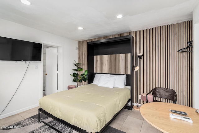 bedroom featuring light tile patterned flooring and recessed lighting