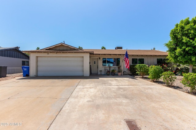13614 N 33rd Ave, Phoenix, AZ 85029 - ranch-style house with an attached garage, driveway, brick siding, board and batten siding, and roof with shingles