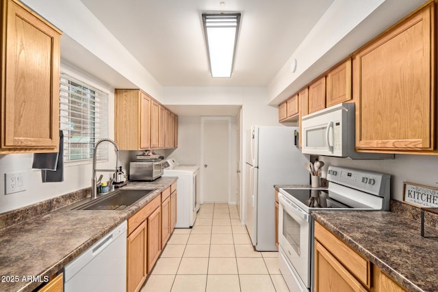 13614 N 33rd Ave, Phoenix, AZ 85029 - kitchen featuring white appliances, separate washer and dryer, dark countertops, and light tile patterned floors