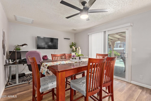 13614 N 33rd Ave, Phoenix, AZ 85029 - dining room with light wood-style floors, a textured ceiling, and ceiling fan