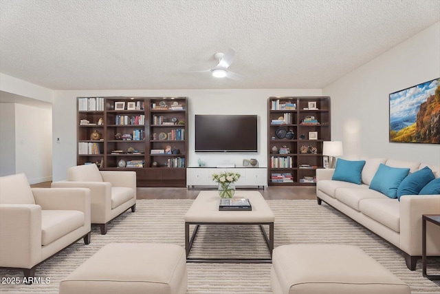 living room featuring a textured ceiling and wood finished floors